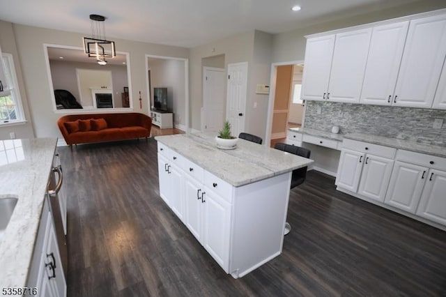 236 Berkley Ave, Montgomery Twp, NJ 08502 - kitchen with dark wood-type flooring, tasteful backsplash, open floor plan, white cabinetry, and a kitchen island