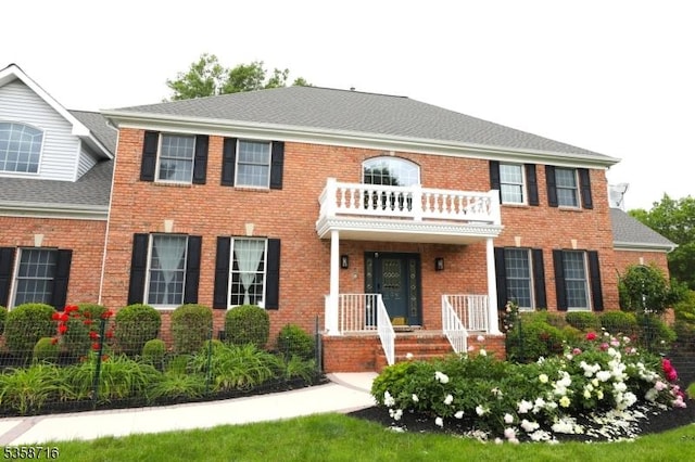 236 Berkley Ave, Montgomery Twp, NJ 08502 - colonial-style house with a balcony and brick siding