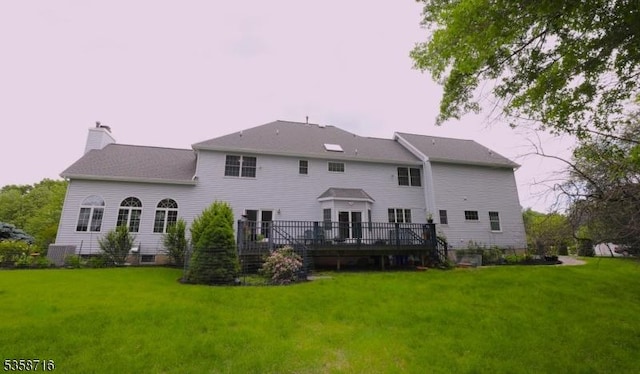 236 Berkley Ave, Montgomery Twp, NJ 08502 - back of property with a lawn, a wooden deck, and a chimney