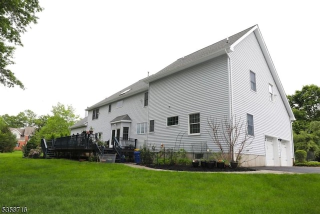 236 Berkley Ave, Montgomery Twp, NJ 08502 - back of property featuring a deck, a lawn, and a garage