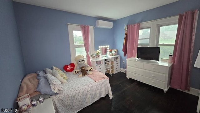 131-133 Sumner Ave, Plainfield City, NJ 07062 - bedroom with a wall unit AC, dark wood-style floors, and baseboards
