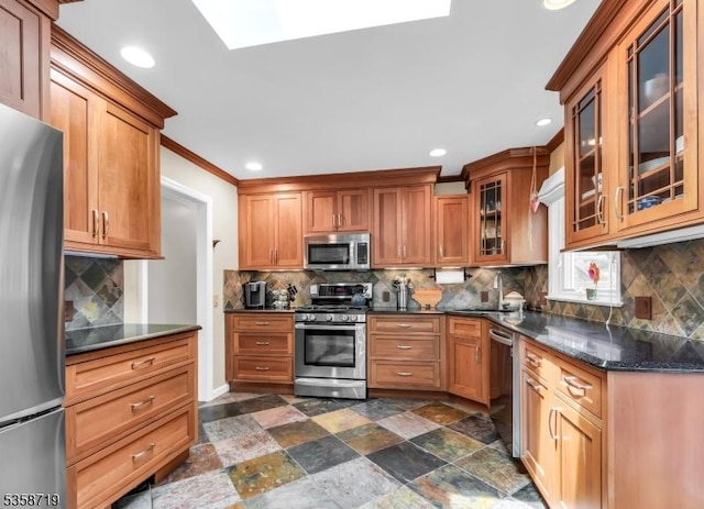 4-A Southview Rd, Randolph Twp, NJ 07869 - kitchen with appliances with stainless steel finishes, backsplash, a sink, glass insert cabinets, and brown cabinetry