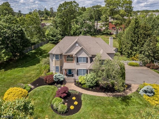 9 Blue Bird Ct, Randolph Twp, NJ 07869 - view of front facade with a chimney and view of wooded area