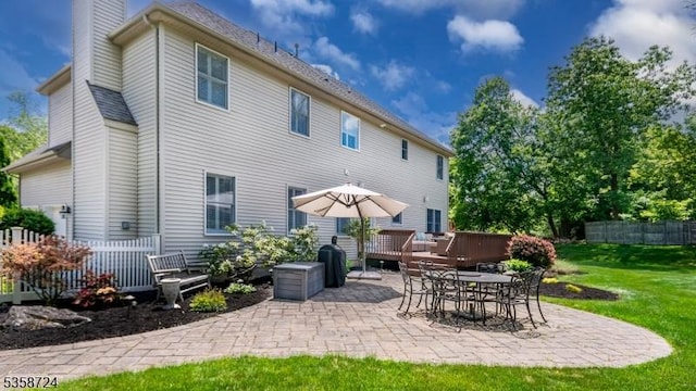 9 Blue Bird Ct, Randolph Twp, NJ 07869 - back of property with a chimney, a patio, and a deck