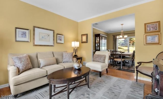 9 Blue Bird Ct, Randolph Twp, NJ 07869 - living area with a chandelier, ornamental molding, wood finished floors, and baseboards