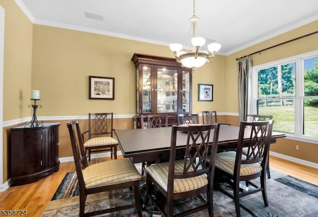 9 Blue Bird Ct, Randolph Twp, NJ 07869 - dining space featuring light wood-style floors, a chandelier, ornamental molding, and baseboards