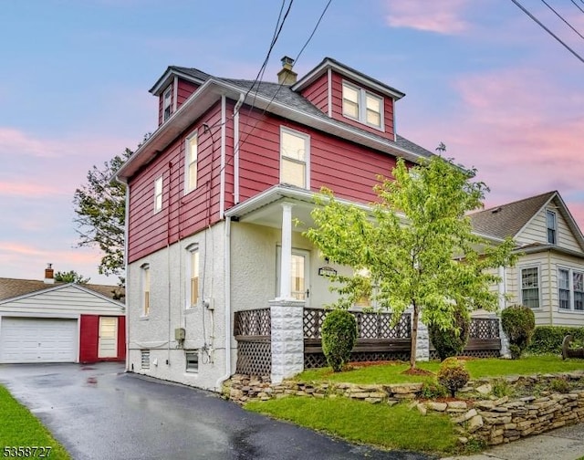1112 W Camplain Rd, Manville Boro, NJ 08835 - american foursquare style home with an outdoor structure, driveway, a detached garage, a chimney, and covered porch
