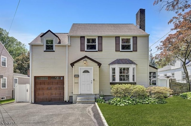 206 Thomas St, Cranford Twp, NJ 07016 - traditional-style house with a chimney, driveway, and an attached garage