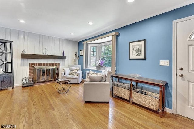 206 Thomas St, Cranford Twp, NJ 07016 - living room featuring light wood finished floors, a fireplace, crown molding, recessed lighting, and baseboards