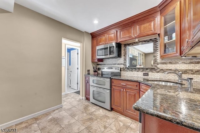 206 Thomas St, Cranford Twp, NJ 07016 - kitchen featuring appliances with stainless steel finishes, decorative backsplash, baseboards, a sink, and recessed lighting