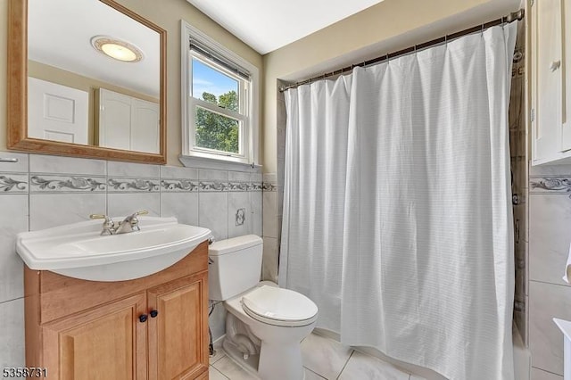 206 Thomas St, Cranford Twp, NJ 07016 - bathroom with vanity, toilet, tile walls, tile patterned flooring, and shower / bath combo with shower curtain