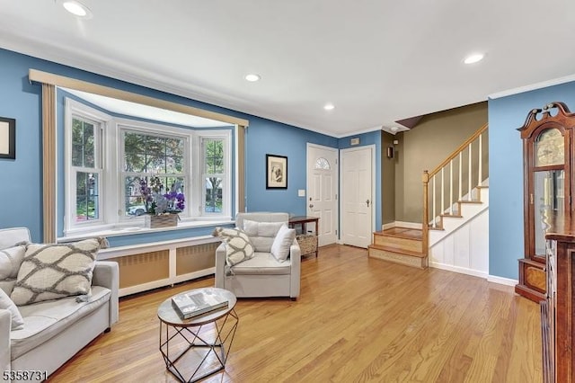 206 Thomas St, Cranford Twp, NJ 07016 - living area featuring stairs, light wood-style floors, ornamental molding, recessed lighting, and radiator heating unit