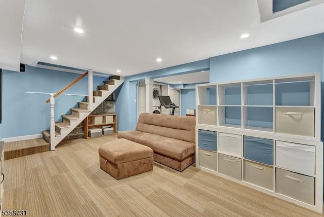 206 Thomas St, Cranford Twp, NJ 07016 - living area with stairs, stacked washing machine and dryer, recessed lighting, and light colored carpet