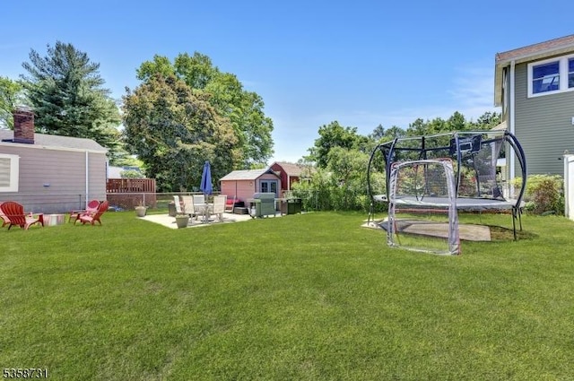 206 Thomas St, Cranford Twp, NJ 07016 - view of yard featuring a trampoline, a patio, and an outdoor structure