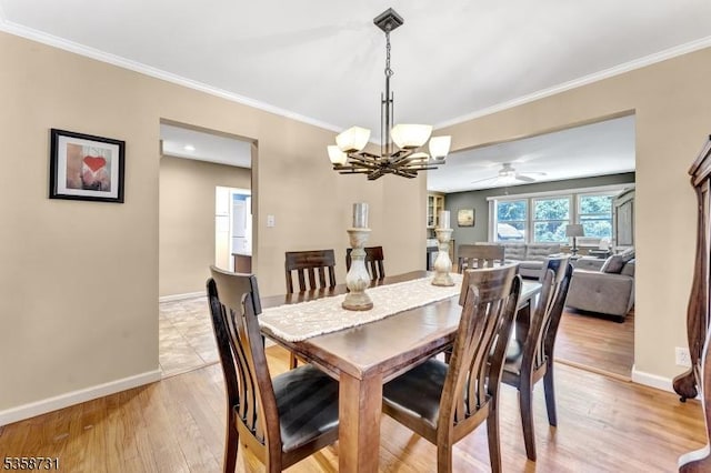 206 Thomas St, Cranford Twp, NJ 07016 - dining room featuring a chandelier, baseboards, light wood-type flooring, crown molding, and ceiling fan