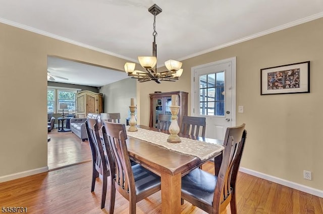 206 Thomas St, Cranford Twp, NJ 07016 - dining room featuring a chandelier, baseboards, light wood-style flooring, and ornamental molding