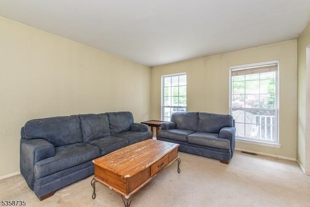 143 Crenshaw Dr, Mount Olive Twp, NJ 07836 - living room with light colored carpet and baseboards