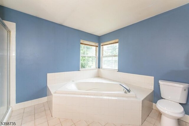 143 Crenshaw Dr, Mount Olive Twp, NJ 07836 - bathroom featuring tile patterned flooring, toilet, a garden tub, baseboards, and an enclosed shower
