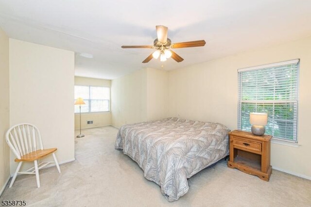 143 Crenshaw Dr, Mount Olive Twp, NJ 07836 - bedroom featuring light colored carpet, baseboards, and a ceiling fan