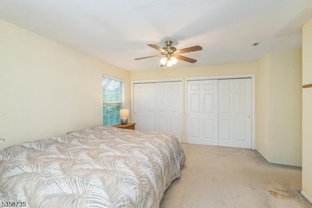 143 Crenshaw Dr, Mount Olive Twp, NJ 07836 - bedroom with multiple closets, light colored carpet, and ceiling fan