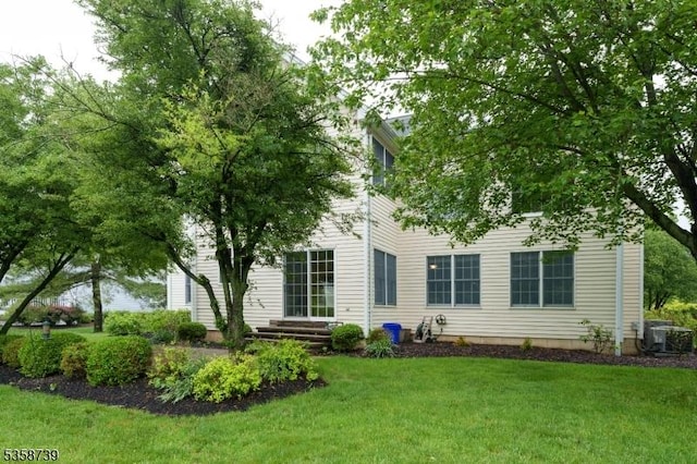 3 Firestone Ct, Montgomery Twp, NJ 08558 - back of house featuring a lawn and central AC unit