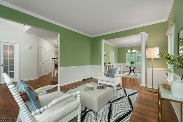 3 Firestone Ct, Montgomery Twp, NJ 08558 - living area with wood finished floors, ornate columns, a chandelier, crown molding, and a wainscoted wall