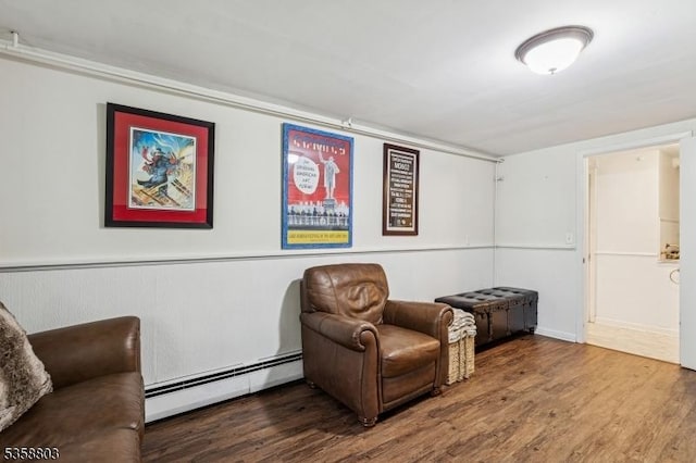 457 Valley Rd, Long Hill Twp, NJ 07933 - living area with a baseboard heating unit and wood finished floors
