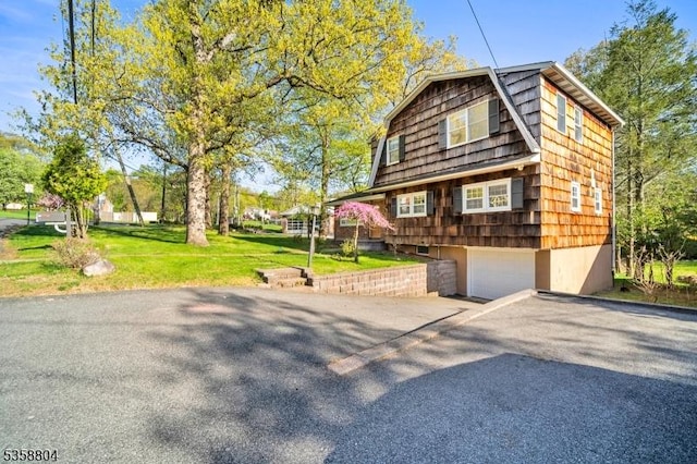 132 Hiawatha Blvd, Oakland Boro, NJ 07436 - view of property exterior featuring driveway, an attached garage, and a lawn