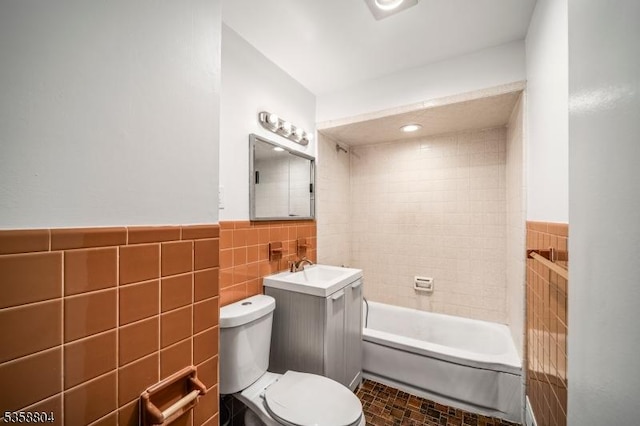 132 Hiawatha Blvd, Oakland Boro, NJ 07436 - full bath featuring tile walls, toilet, wainscoting, vanity, and bathing tub / shower combination