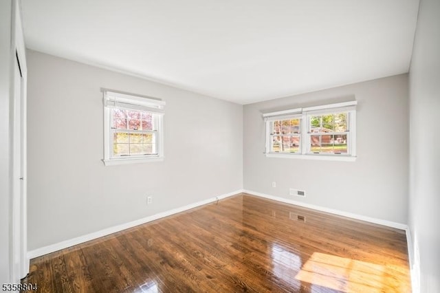 132 Hiawatha Blvd, Oakland Boro, NJ 07436 - empty room featuring plenty of natural light, baseboards, and wood finished floors