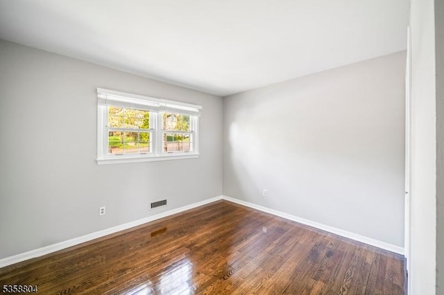 132 Hiawatha Blvd, Oakland Boro, NJ 07436 - spare room with dark wood-type flooring and baseboards