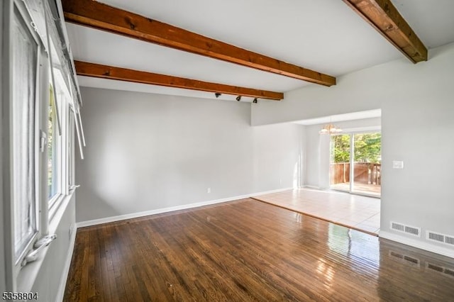 132 Hiawatha Blvd, Oakland Boro, NJ 07436 - empty room featuring a chandelier, wood finished floors, beam ceiling, and baseboards