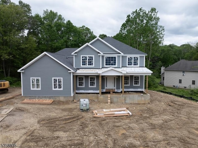 1 Lourdes Ct, Andover Twp, NJ 07821 - view of front facade featuring covered porch and view of wooded area