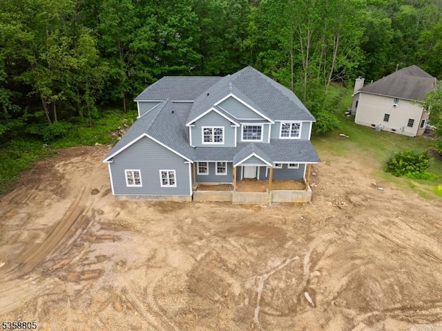 1 Lourdes Ct, Andover Twp, NJ 07821 - view of front of home with a shingled roof, a porch, and a wooded view