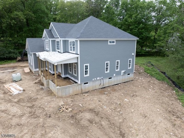 1 Lourdes Ct, Andover Twp, NJ 07821 - view of side of home with a shingled roof, view of wooded area, a porch, and crawl space