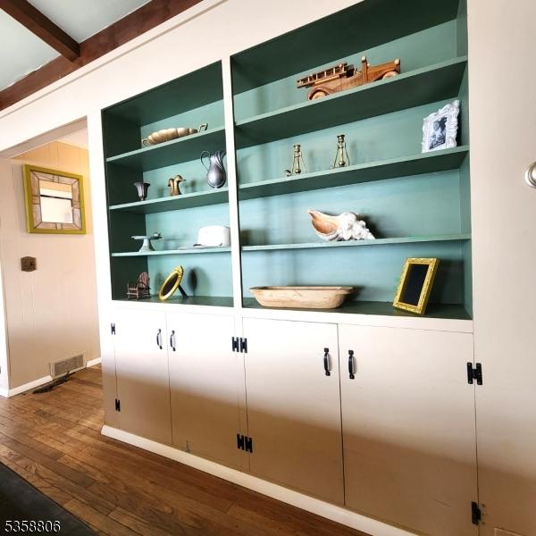 110 Lower N Shore Rd, Frankford Twp, NJ 07826 - detailed view of wood finished floors, baseboards, built in shelves, and beam ceiling