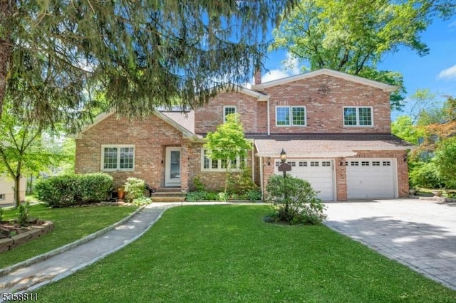 21-23 Sheridan Ave, West Orange Twp, NJ 07052 - traditional-style house featuring an attached garage, driveway, a front lawn, and brick siding