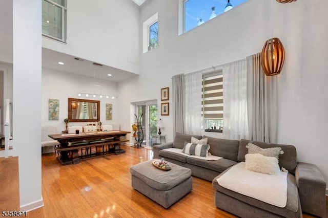 21-23 Sheridan Ave, West Orange Twp, NJ 07052 - living room featuring wood finished floors and a towering ceiling