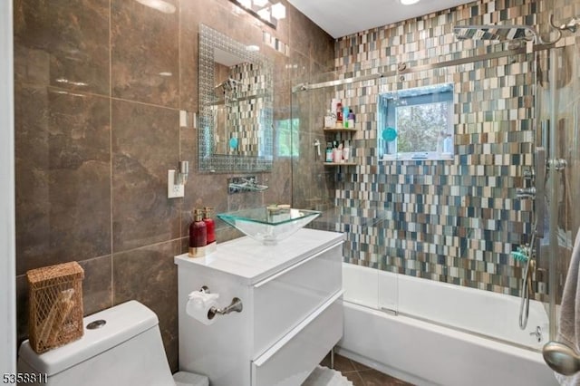 21-23 Sheridan Ave, West Orange Twp, NJ 07052 - bathroom with tile walls, toilet, tile patterned flooring, shower / bathtub combination, and vanity