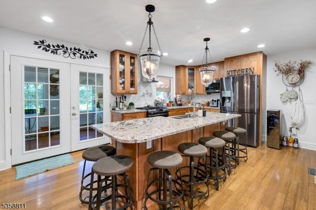 21-23 Sheridan Ave, West Orange Twp, NJ 07052 - kitchen featuring stainless steel appliances, a sink, light wood-type flooring, brown cabinets, and recessed lighting