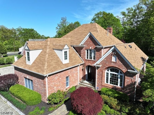 15 Hemlock Ave, Frankford Twp, NJ 07826 - traditional-style home featuring brick siding, a chimney, and roof with shingles