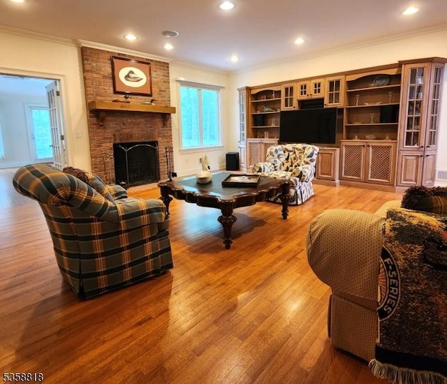 15 Hemlock Ave, Frankford Twp, NJ 07826 - living room with ornamental molding, light wood-style floors, a fireplace, and recessed lighting