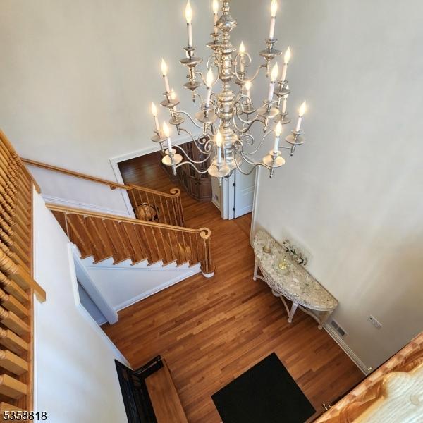 15 Hemlock Ave, Frankford Twp, NJ 07826 - stairway featuring wood finished floors and a chandelier