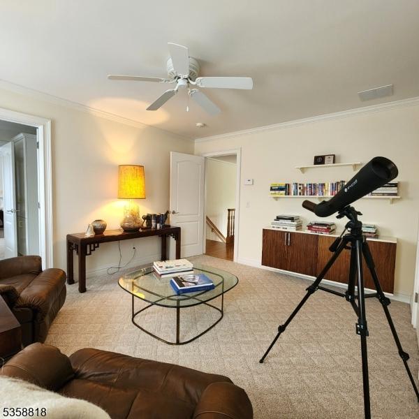 15 Hemlock Ave, Frankford Twp, NJ 07826 - carpeted living room with crown molding, baseboards, and a ceiling fan