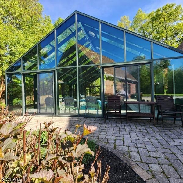15 Hemlock Ave, Frankford Twp, NJ 07826 - rear view of property with a patio area, a lanai, and an outdoor pool