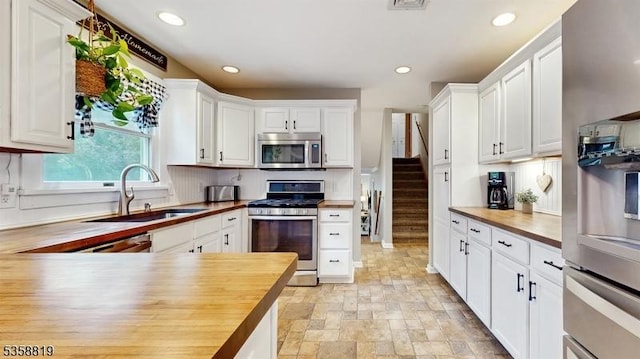 6 County Road 579, East Amwell Twp, NJ 08551 - kitchen featuring stainless steel appliances, wood counters, a sink, white cabinetry, and recessed lighting