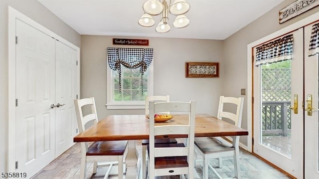 6 County Road 579, East Amwell Twp, NJ 08551 - dining area with a chandelier, healthy amount of natural light, light stone finish flooring, and baseboards