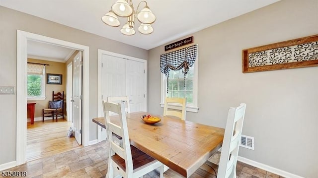 6 County Road 579, East Amwell Twp, NJ 08551 - dining space with a chandelier, stone finish flooring, baseboards, and crown molding