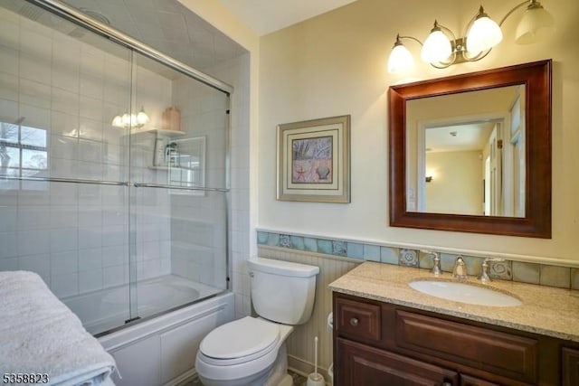599 Point Ave, Brick Twp, NJ 08724 - bathroom featuring vanity, toilet, enclosed tub / shower combo, wainscoting, and a chandelier