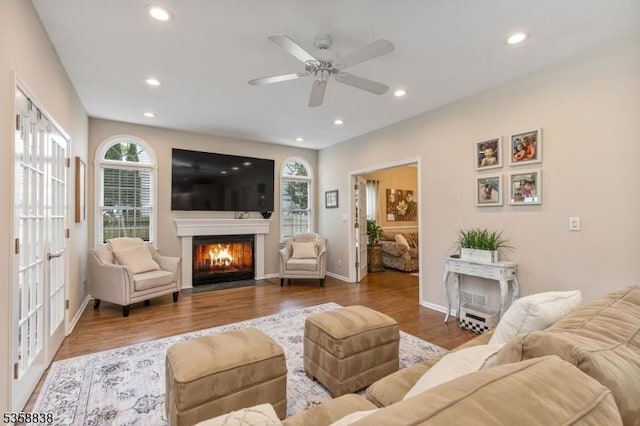 411 Arlington Ave, South Plainfield Boro, NJ 07080 - living room with healthy amount of natural light, a ceiling fan, a fireplace with flush hearth, wood finished floors, and recessed lighting